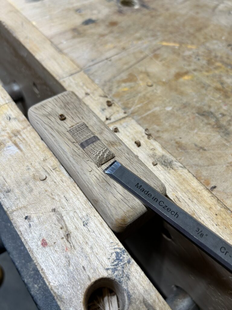 Chiseling slight chamfers around the proud tenon on the mallet