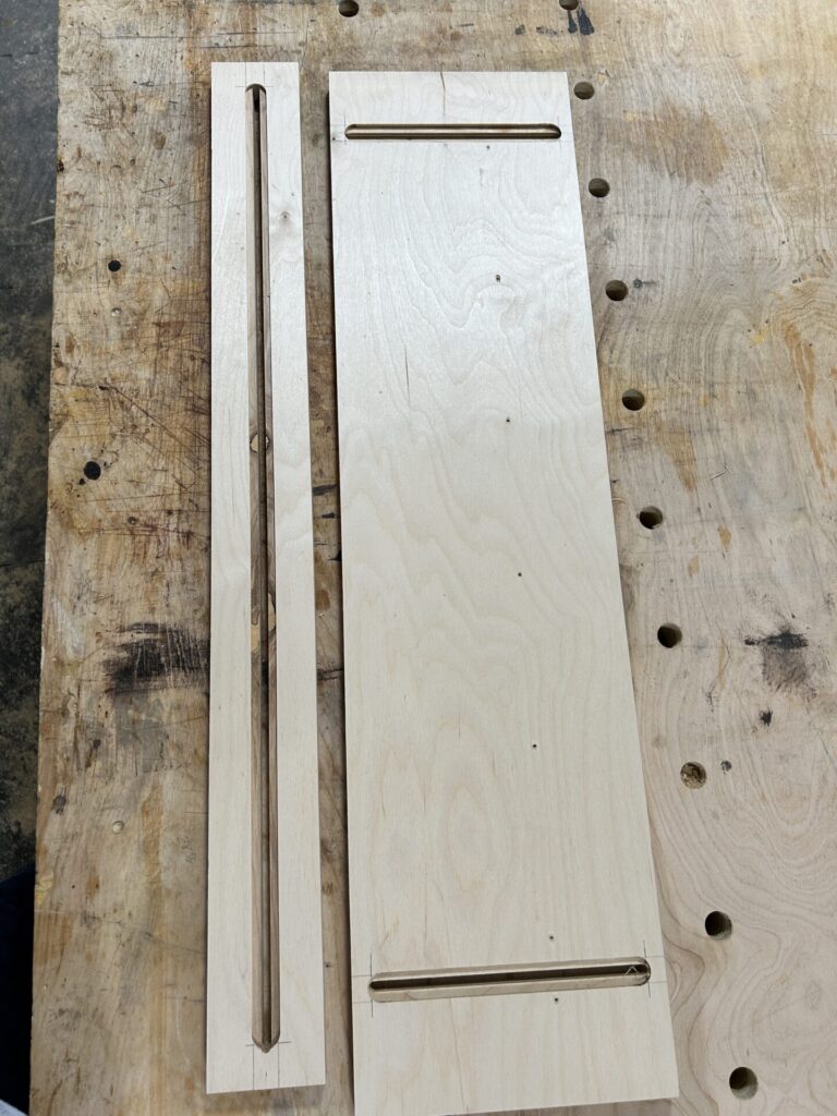 Base and guide with T-bolt slots cut
